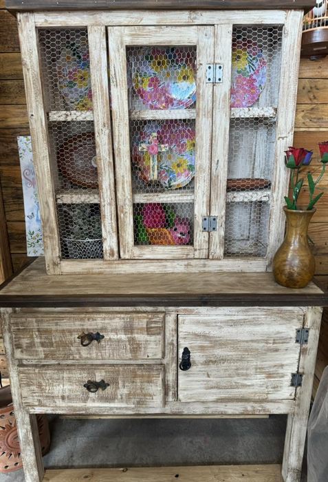Two-door painted wood cabinet with wire mesh panels
