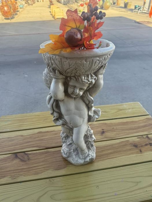 Plaster cherub planter with a basket top