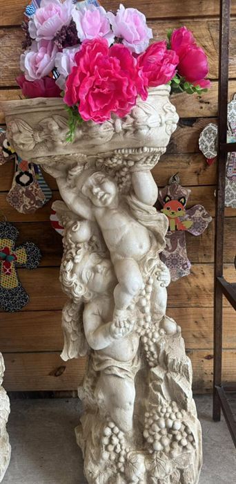 Plaster cherub pedestal with a planter top