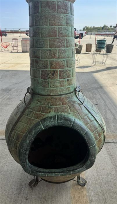 Tall teal glazed clay chiminea