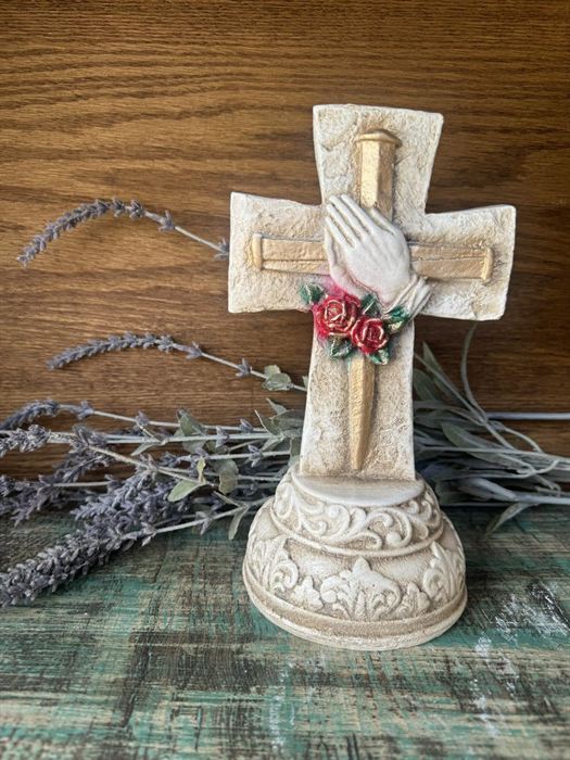 Plaster cross with a dove, on a plinth
