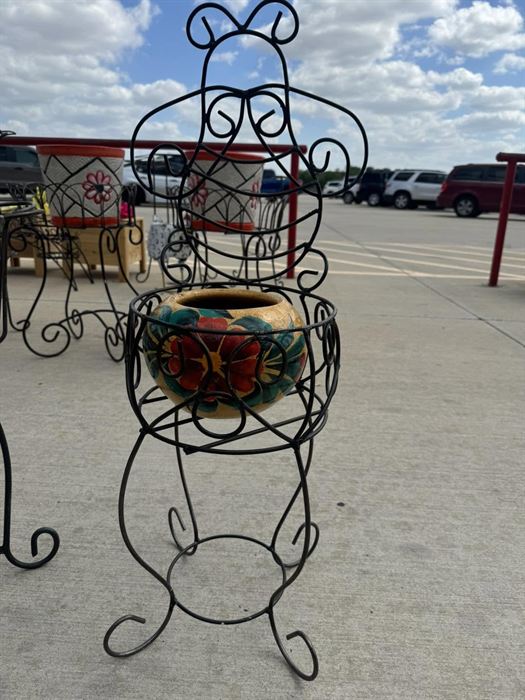 Tall column-form wrought iron plant stand