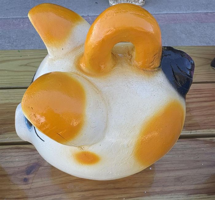 Hand-painted clay pig bank in cream and orange