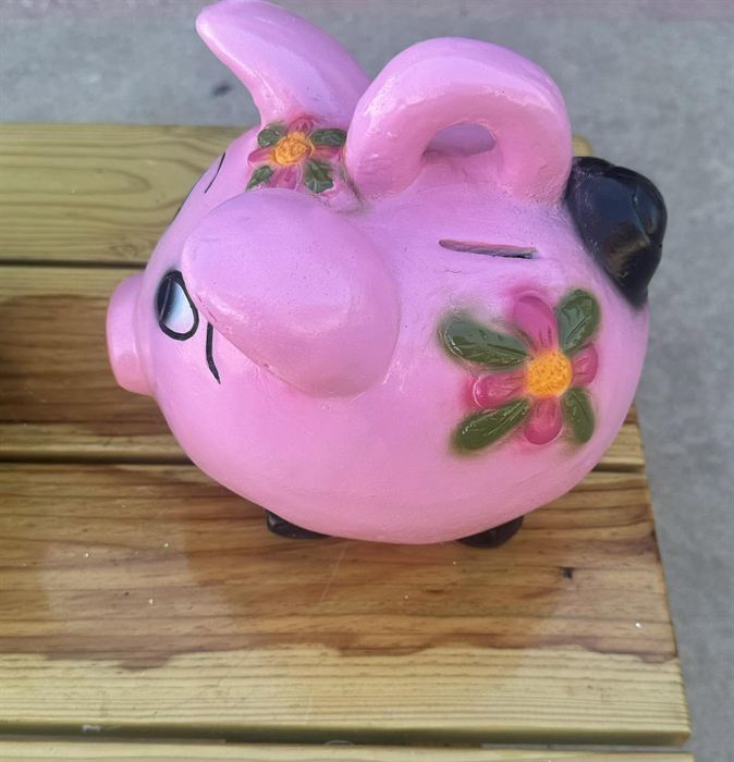 Hand-painted pink clay pig bank with floral detail