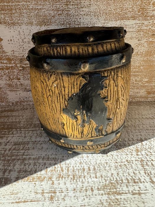 Fired clay pot carved with a horse in relief