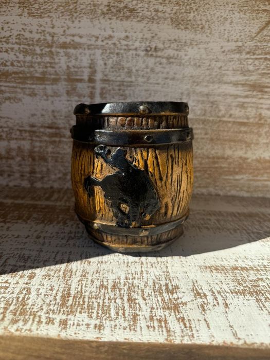 Fired clay pot with sunflower relief carving