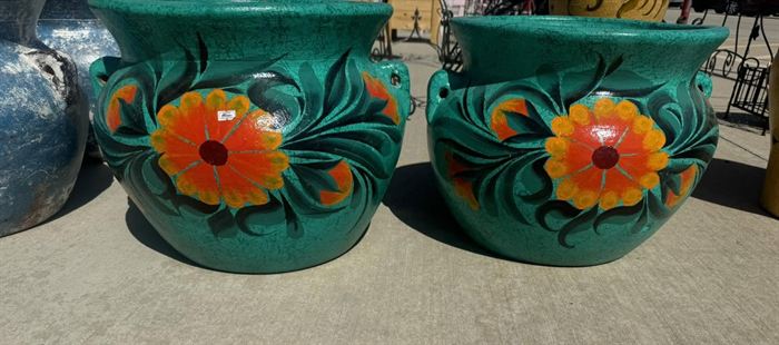 Hand-painted talavera pots on a teal ground