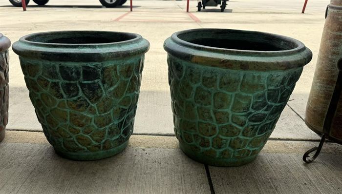 A pair of large green planters with a textured glaze