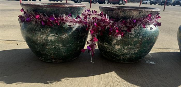 Dark glazed pots planted with flowers