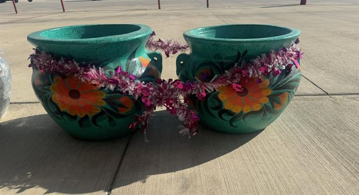 A pair of teal glazed pots