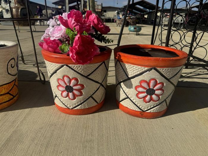 Hand-painted flower pots with banded orange rims