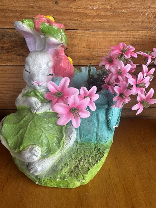 Seated painted plaster rabbit planted with flowers