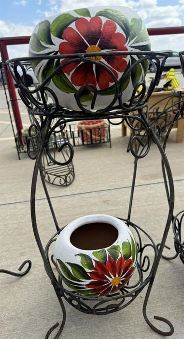 Wrought iron stand holding a talavera pot